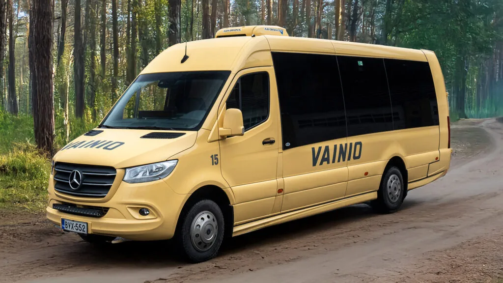a yellow van parked on a dirt road